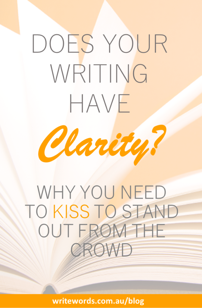 Blank notepad on orange background with text overlay – Does your writing have clarity? Why you need to KISS to stand out from the crowd